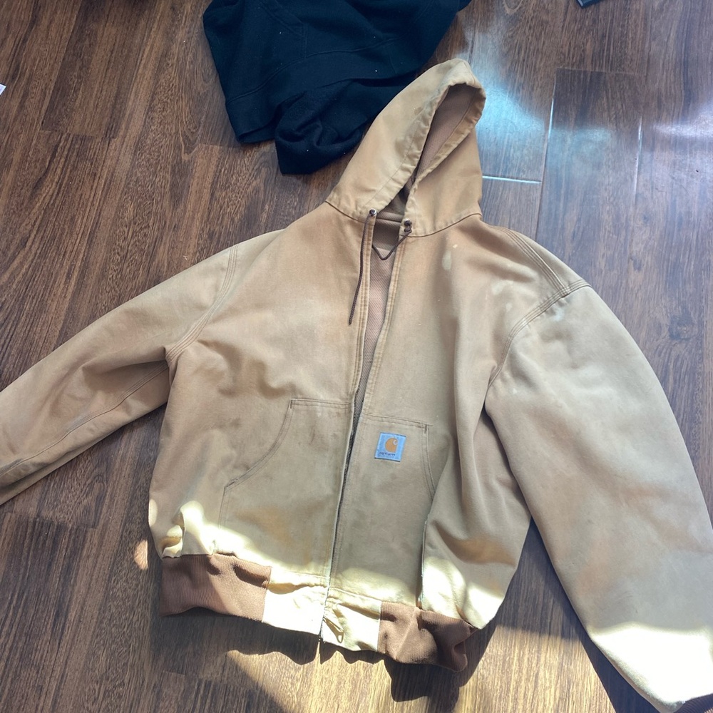 Carhartt work jacket.  Tan. Weathered